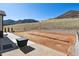 Exterior view of the backyard with gravel and dirt area with a blue sky above at 4526 Mesa Top Dr, Monument, CO 80132