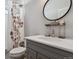 Bathroom features granite counters, modern fixtures, and a floral shower curtain at 4526 Mesa Top Dr, Monument, CO 80132