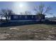 Exterior of home with siding and trimmed lawn at 7486 Patrick St, Fort Lupton, CO 80621