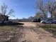 Long driveway leading up to property with parked vehicles at 7486 Patrick St, Fort Lupton, CO 80621