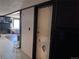 Hallway with laminate flooring connecting rooms of the house, providing easy access to different living spaces at 7486 Patrick St, Fort Lupton, CO 80621