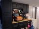 Kitchen with dark cabinetry and ample storage space, perfect for cooking enthusiasts at 7486 Patrick St, Fort Lupton, CO 80621