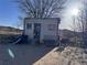 Exterior shot of small shed with colorful door at 7486 Patrick St, Fort Lupton, CO 80621