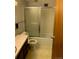 Bathroom with shower-tub combination, single vanity, and commode at 9335 E Center Ave # 7C, Denver, CO 80247