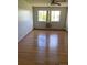A bedroom with hardwood floors, and natural light from the window at 9335 E Center Ave # 7C, Denver, CO 80247