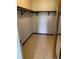 Walk-in closet with neutral floors and a shelf for storage at 9335 E Center Ave # 7C, Denver, CO 80247