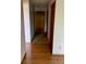 View of the front door with tile, and hardwood floors in the hallway at 9335 E Center Ave # 7C, Denver, CO 80247