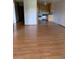 Open concept living and kitchen space with hardwood floors and natural light at 9335 E Center Ave # 7C, Denver, CO 80247