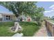 Spacious, well-maintained backyard with mature trees, a storage shed, and a wood fence at 10560 W 102Nd Pl, Broomfield, CO 80021