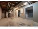 Unfinished basement with utilities, an extra room, painted walls, and concrete floor at 10560 W 102Nd Pl, Broomfield, CO 80021