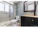 Clean bathroom with glass shower, a modern vanity, new fixtures, and updated toilet at 10560 W 102Nd Pl, Broomfield, CO 80021