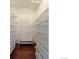 Walk-in closet showing custom shelving with ample storage, plus dark, solid-wood flooring at 10560 W 102Nd Pl, Broomfield, CO 80021