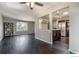 Open-concept living area adjacent to a modern kitchen with stainless steel appliances at 10560 W 102Nd Pl, Broomfield, CO 80021