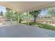 View of the covered patio with a concrete slab and lush backyard at 10560 W 102Nd Pl, Broomfield, CO 80021