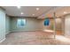 Basement area with carpeting and two small windows at 12388 E Caspian Dr, Aurora, CO 80014