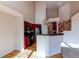 Modern kitchen with stainless steel appliances, granite countertops, and red cabinets in an open space at 12388 E Caspian Dr, Aurora, CO 80014