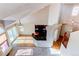 Bright living space featuring hardwood floors, a large window, and a bar with updated cabinets at 12388 E Caspian Dr, Aurora, CO 80014