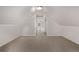 Finished attic with neutral carpet offering ample space and dormer window views at 30 Fox St, Denver, CO 80223
