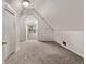 Finished attic space featuring unique architectural details and neutral carpeting at 30 Fox St, Denver, CO 80223