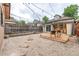Charming backyard with gravel, stepping stones and wooden deck for relaxed outdoor living at 30 Fox St, Denver, CO 80223