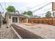 Charming backyard features string lights, a small deck, and gravel landscaping for a relaxing outdoor space at 30 Fox St, Denver, CO 80223