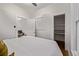 A bedroom featuring a bed, closet, and a window at 30 Fox St, Denver, CO 80223