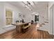 Bright dining room with hardwood floors, natural light, and access to the living room at 30 Fox St, Denver, CO 80223