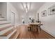 Dining room features a rustic wooden table and staircase access at 30 Fox St, Denver, CO 80223