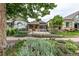 Charming home with front yard with garden beds, stone pathway, and inviting curb appeal at 30 Fox St, Denver, CO 80223