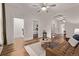Living room boasts beautiful hardwood floors and is filled with natural light at 30 Fox St, Denver, CO 80223