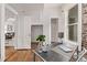Bright office space with hardwood floors, exposed brick, and a large window at 30 Fox St, Denver, CO 80223
