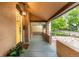 Cozy front porch featuring a yellow door, plants, and warm lighting for a welcoming entrance at 30 Fox St, Denver, CO 80223
