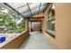 Enclosed front porch featuring unique metal awning and ample light, enhancing the home's charm at 30 Fox St, Denver, CO 80223