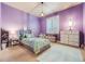 bedroom featuring purple painted walls, carpet and lots of natural light at 10882 E 162Nd Pl, Brighton, CO 80602