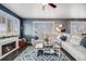 Comfortable living room with fireplace, modern furniture, large windows with natural light and stylish decor at 10882 E 162Nd Pl, Brighton, CO 80602