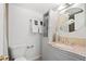 Bathroom featuring vanity with granite top, modern fixtures, and decorative storage at 252 N Pennsylvania St # 305, Denver, CO 80203