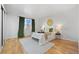 Bright bedroom with hardwood floors, large window, and stylish decor at 252 N Pennsylvania St # 305, Denver, CO 80203