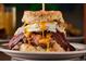 Close up shot of a breakfast sandwich with egg and bacon at 252 N Pennsylvania St # 305, Denver, CO 80203
