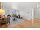 Spacious living room with hardwood floors, fireplace, and plenty of natural light at 252 N Pennsylvania St # 305, Denver, CO 80203