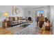 Cozy living room with fireplace, stylish rug, and comfortable seating area at 252 N Pennsylvania St # 305, Denver, CO 80203