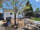 Backyard featuring a grill, patio set, and fenced yard, ideal for outdoor gatherings and relaxation at 8 S Kendall St, Lakewood, CO 80226