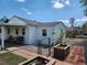 Cozy home with a fenced yard, patio area, and landscaping, perfect for outdoor living and entertaining at 8 S Kendall St, Lakewood, CO 80226