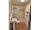 This bathroom features a shower and tub combination with a sliding door at 8 S Kendall St, Lakewood, CO 80226