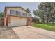 Charming two-story home with a large two-car garage and concrete driveway at 1824 S Granby St, Aurora, CO 80012