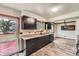 Stylish kitchen equipped with dark cabinets, granite countertops, and modern appliances at 1824 S Granby St, Aurora, CO 80012