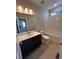 This bathroom has a sink, a mirror, and a toilet next to a tub and shower at 393 Grey Rock St, Brighton, CO 80601