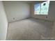 Large bedroom with window and neutral walls at 393 Grey Rock St, Brighton, CO 80601