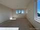 Well-lit main bedroom with large windows at 393 Grey Rock St, Brighton, CO 80601