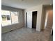 This bedroom has neutral paint, carpet, and a closet with sliding doors at 393 Grey Rock St, Brighton, CO 80601