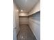 Walk-in closet with built-in shelving for optimized storage and organization at 393 Grey Rock St, Brighton, CO 80601